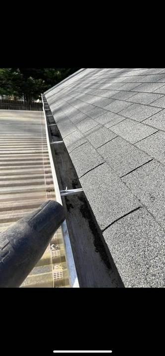 Gutter cleared out during a seasonal property cleanup