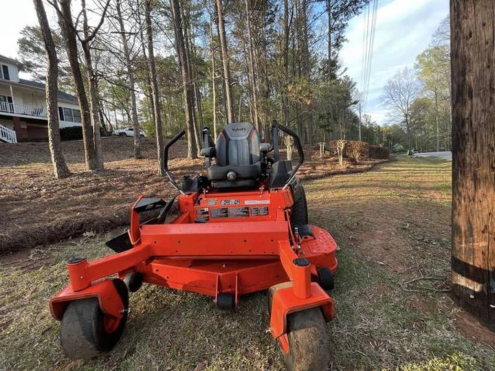 Zero-turn mower on a residential lawn route